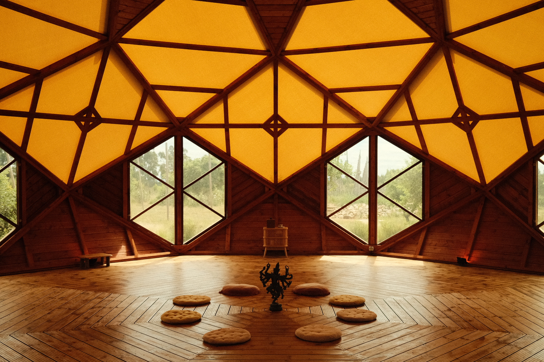 An open wooden Zome prepared for gathering and contemplation